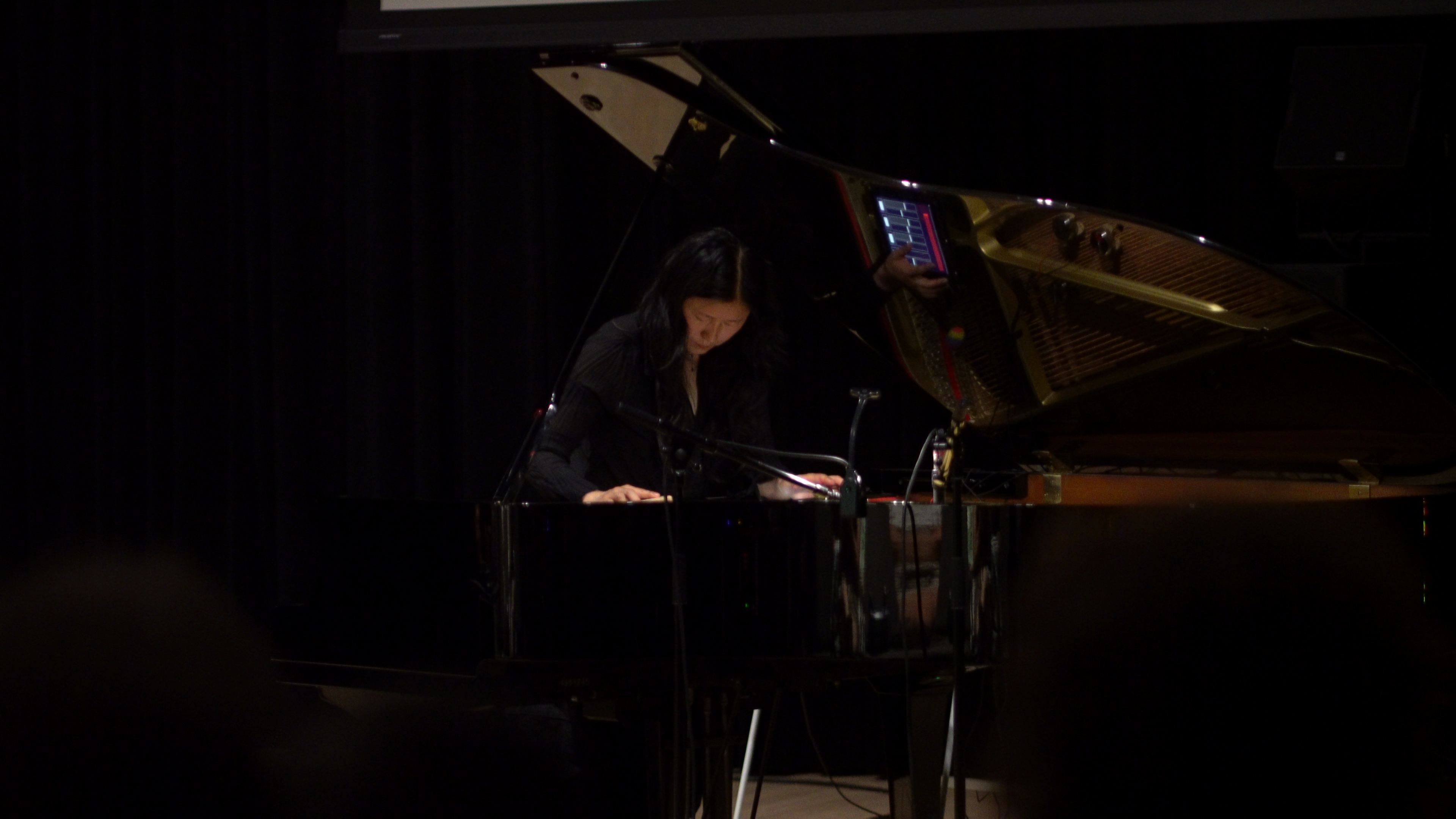 woman playing sustained piano